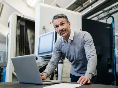 Man uses ERP system from warehouse floor